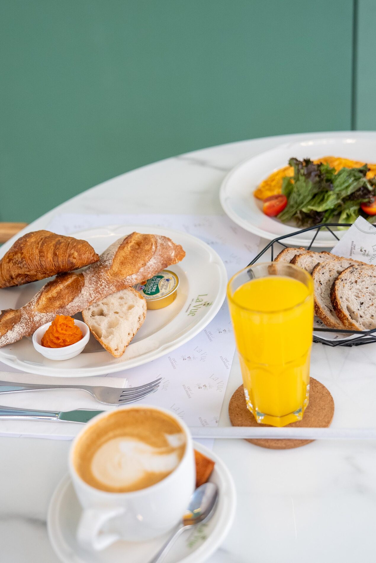 La Vue Café - croissant, juice and coffee