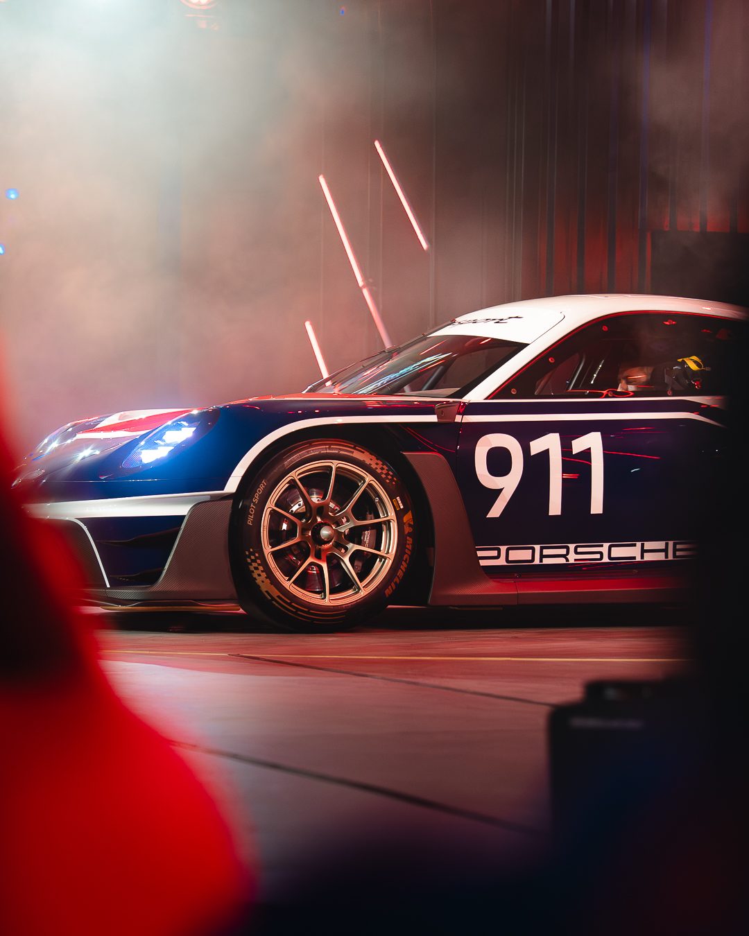 Icons of Porsche - race car on stage
